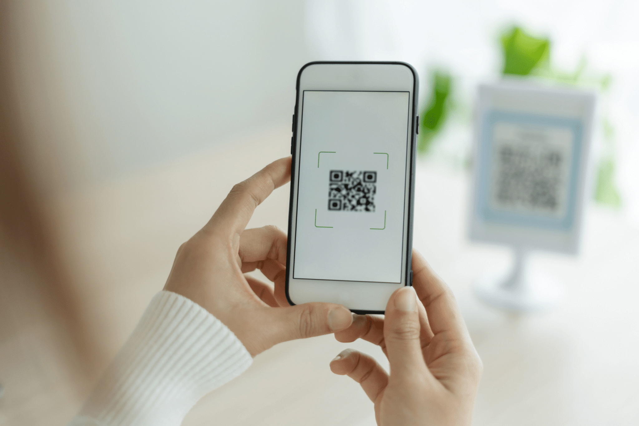 person using a QR code
