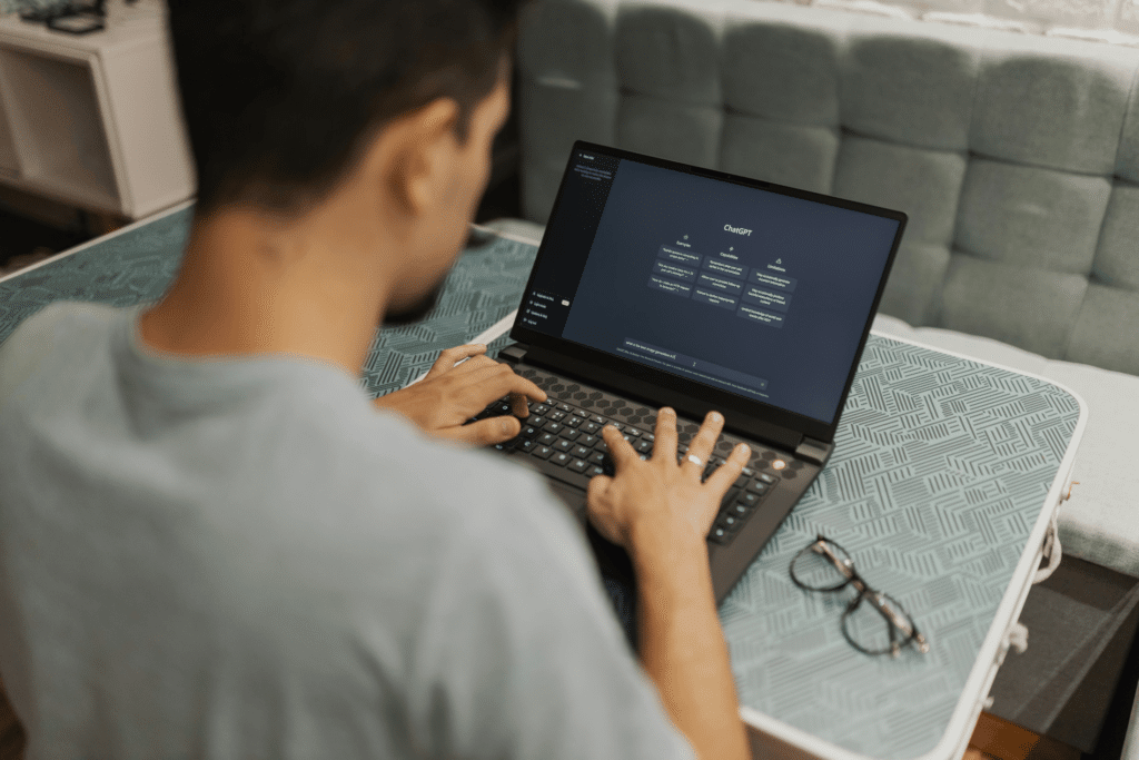 person using chatgpt on their laptop