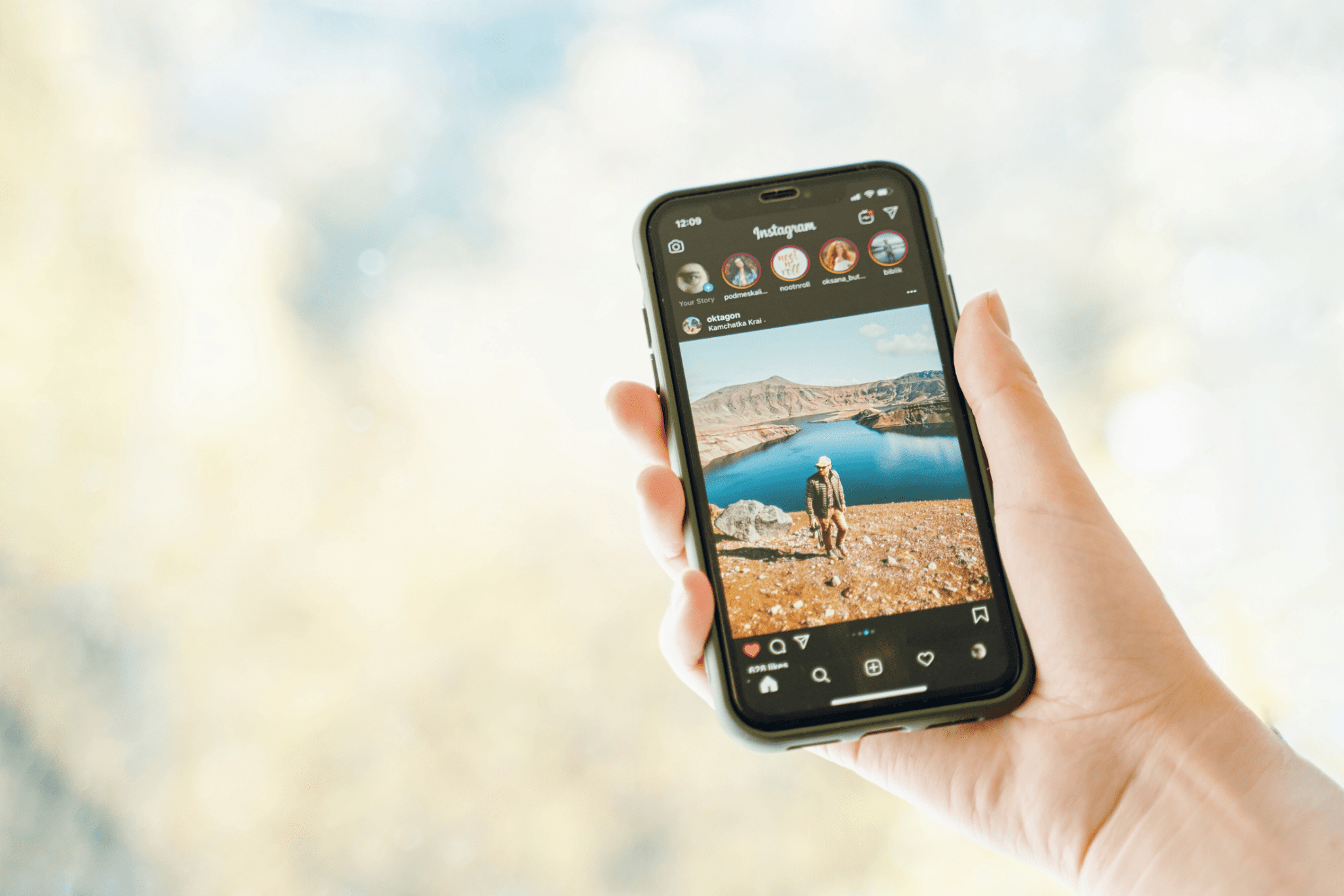 person holding a phone with instagram open