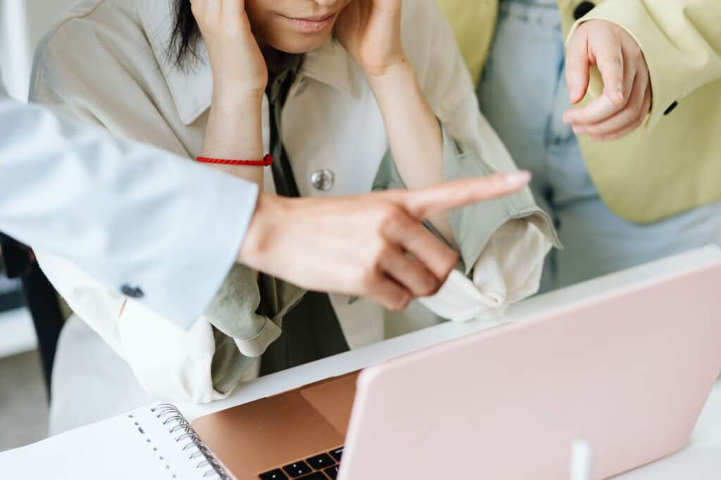 team reviewing how to respond to a negative review