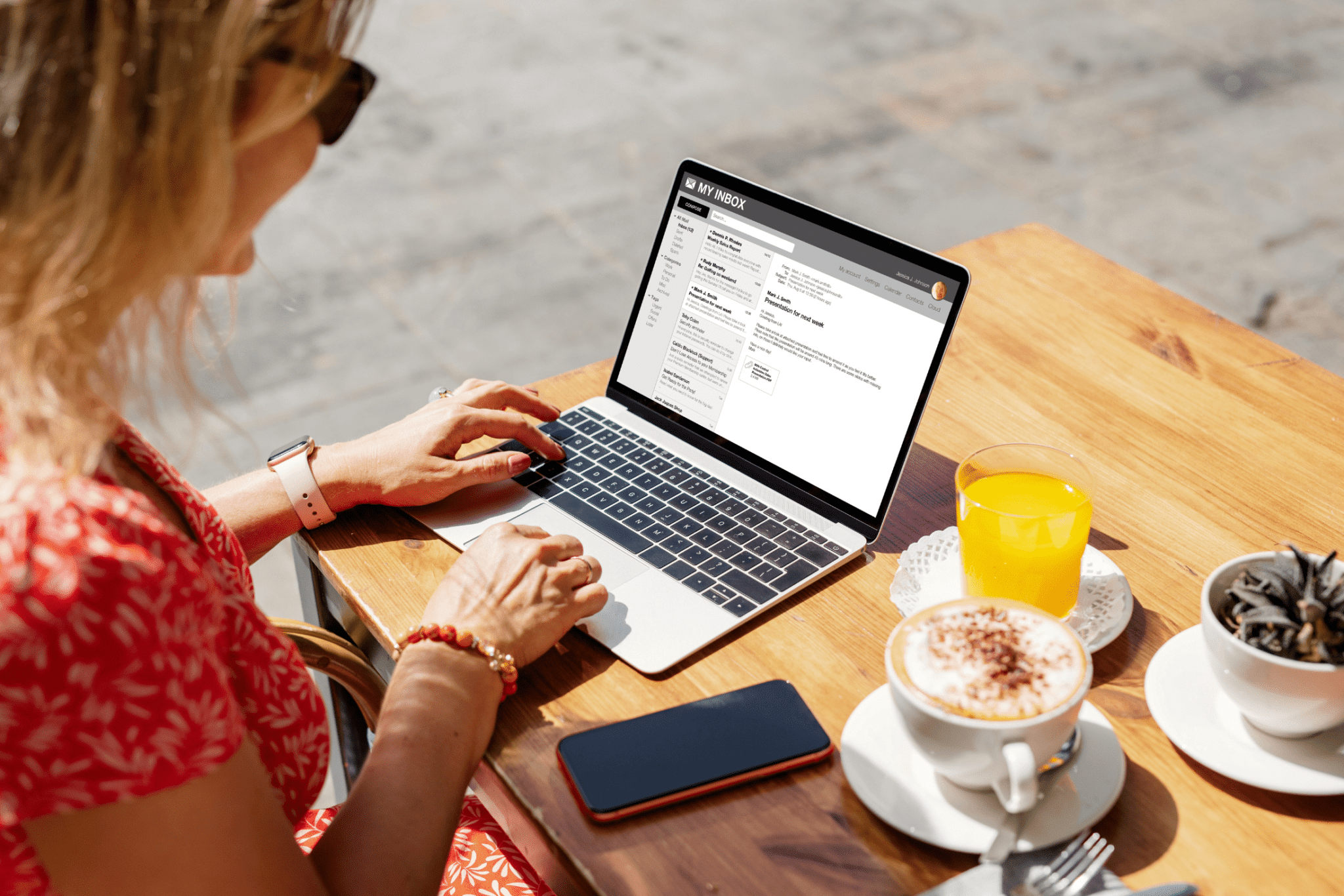 person checking email at a cafe