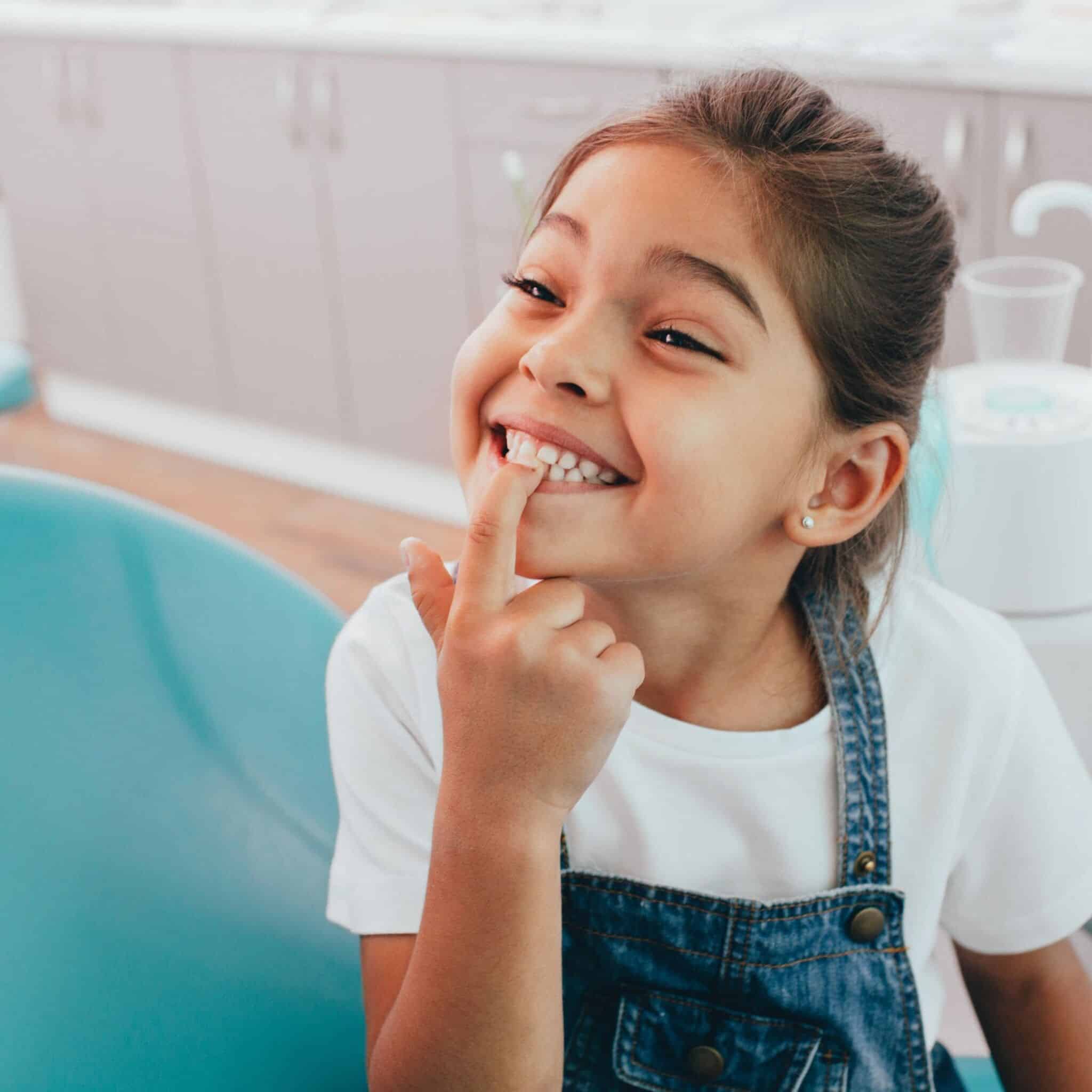 child showing teeth to dentist child showing teeth to dentist
