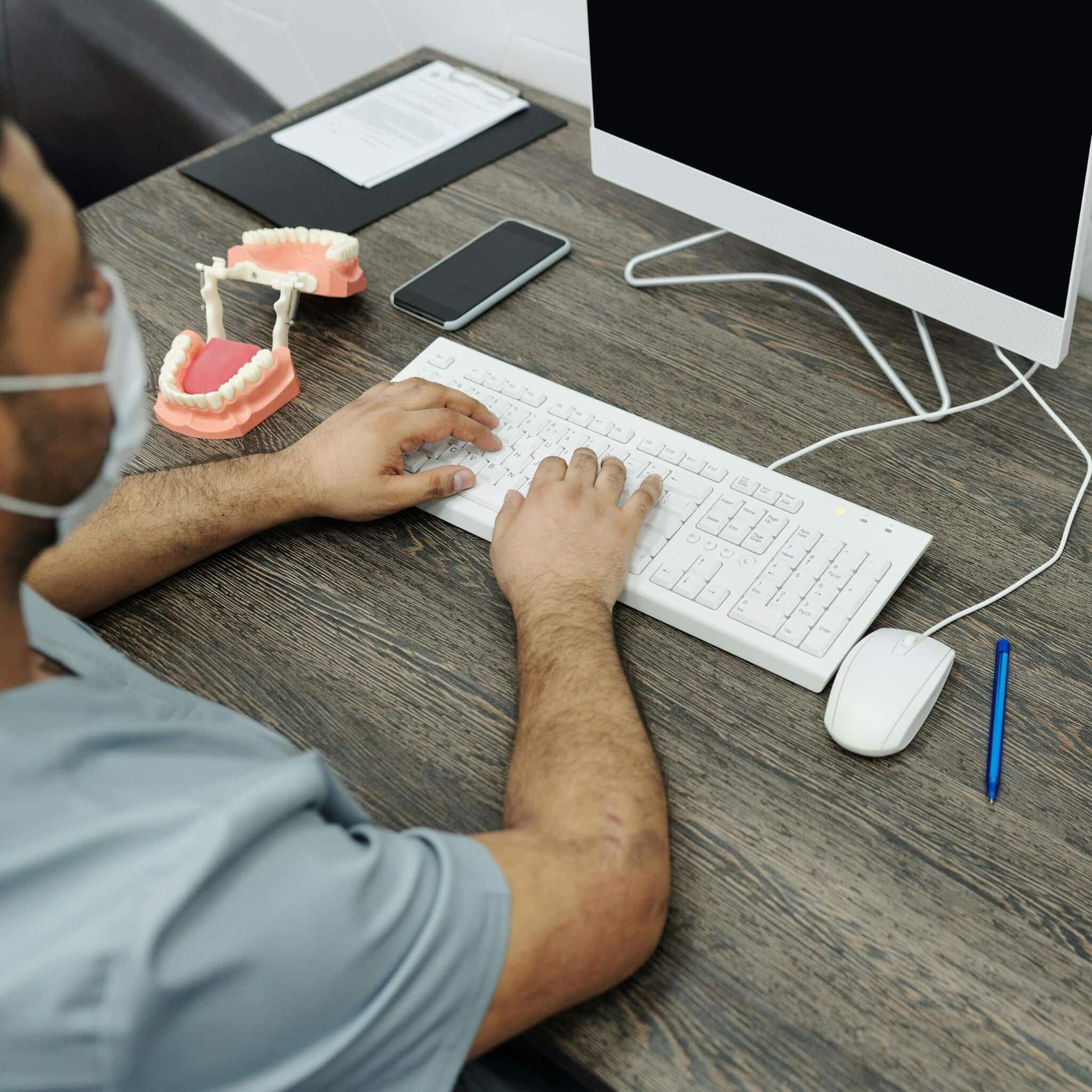 dentist logging onto computer dentist logging onto computer
