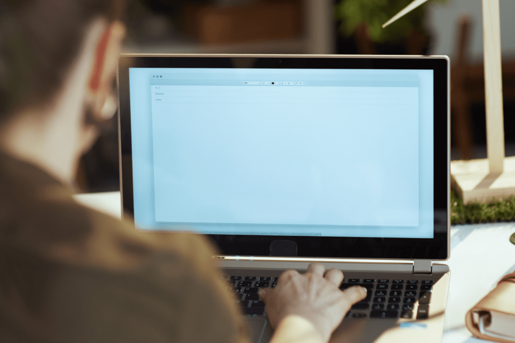 Person checking their work email on a laptop