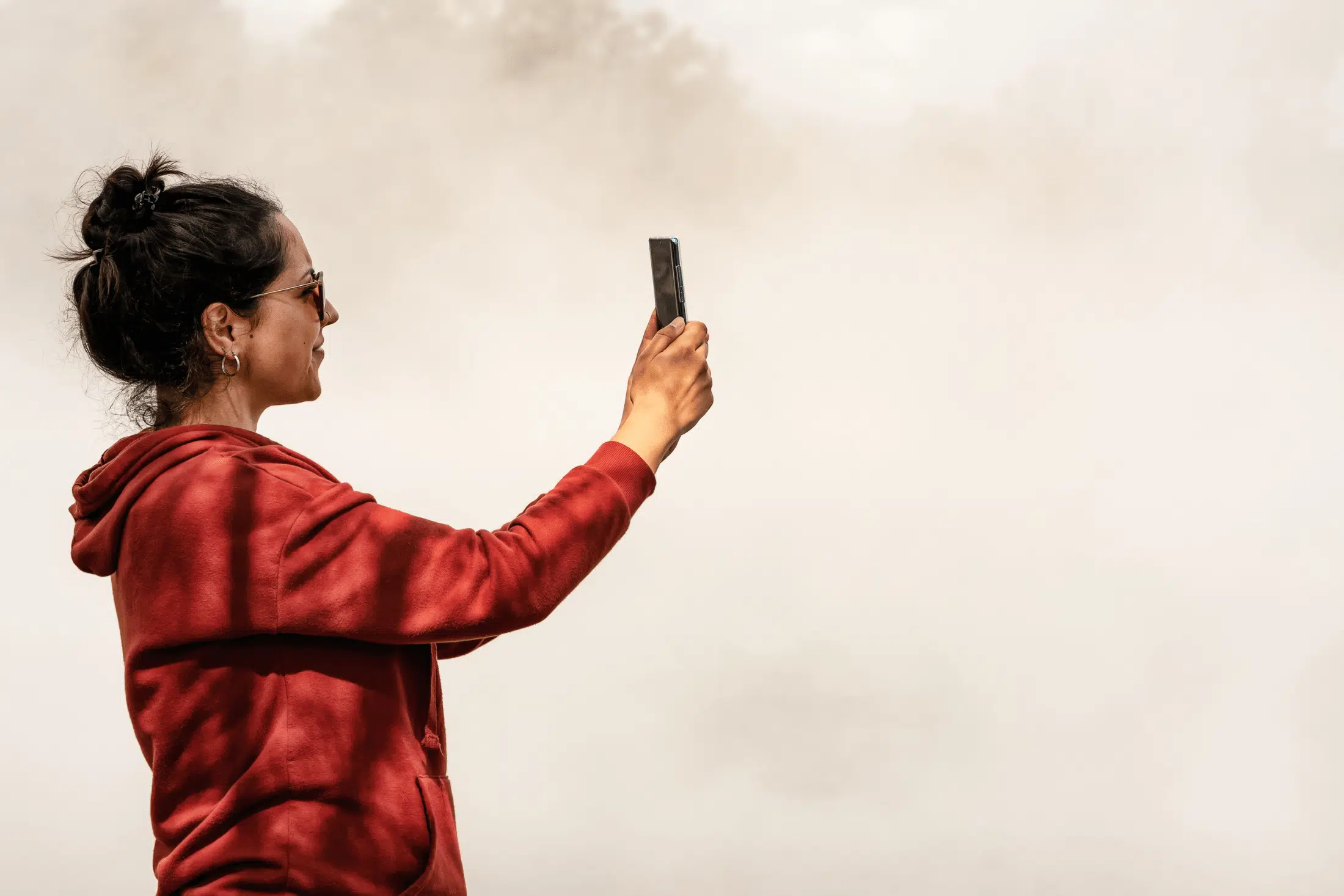 woman taking picture for social media