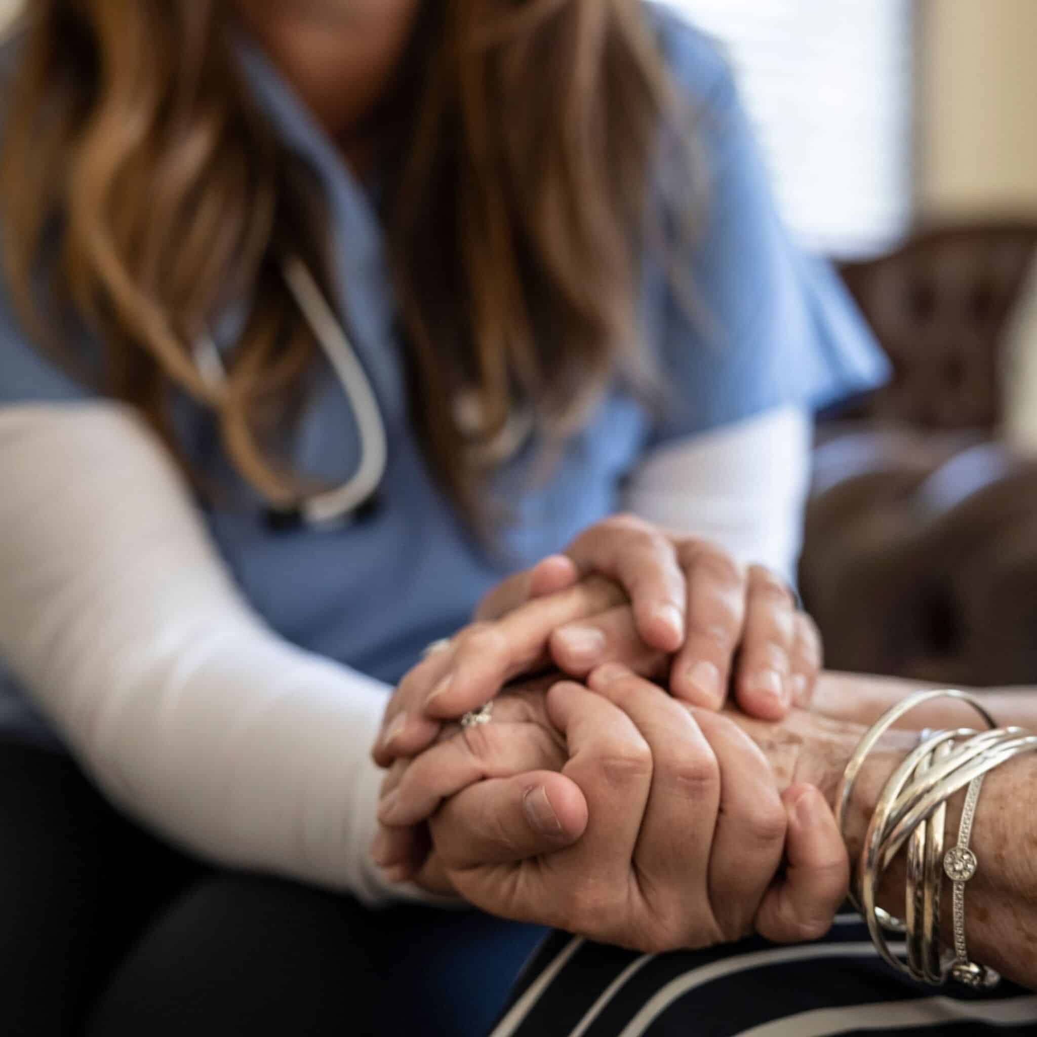 doctor holding patient’s hand doctor holding patient's hand