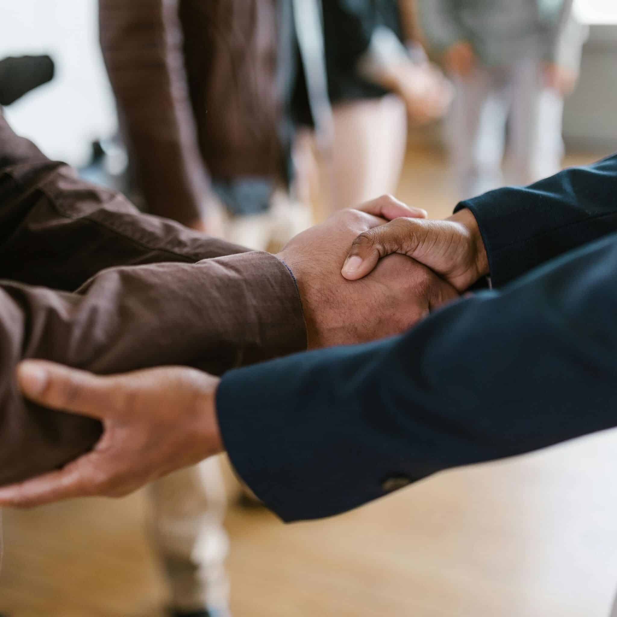 people shaking hands people shaking hands