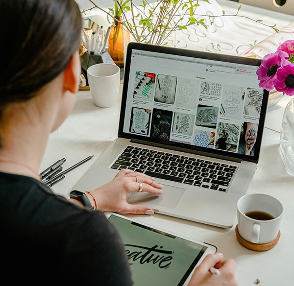 website-editing person scrolling through pinterest